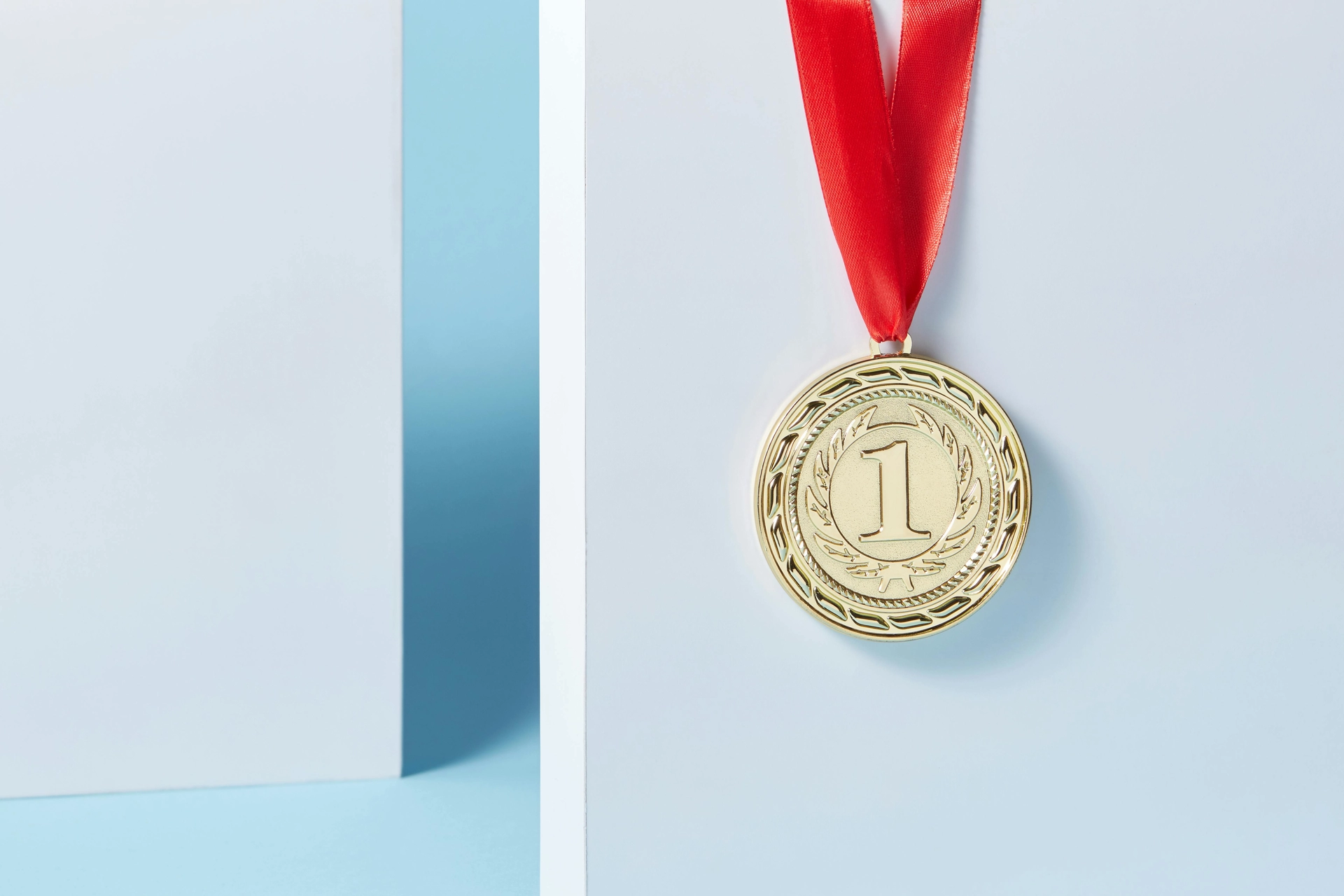 Gold medal with red ribbon